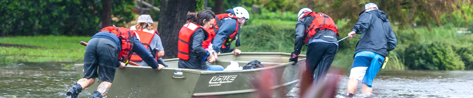 Firefighters pushing a rescue boat
